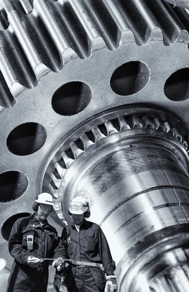 Mechanics with giant gears and cogwheel axle — Stock Photo, Image