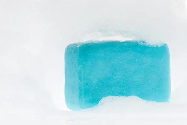 Blue soap with foam on white background — Stock Photo, Image
