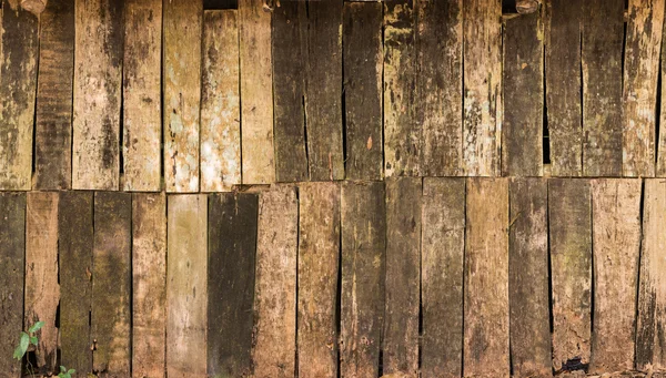 Bakgrund av förfall trä på gamla stuga väggyta — Stockfoto