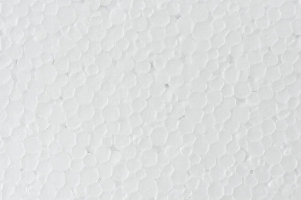 Background of white foamed polystyrene surface — Stock Photo, Image