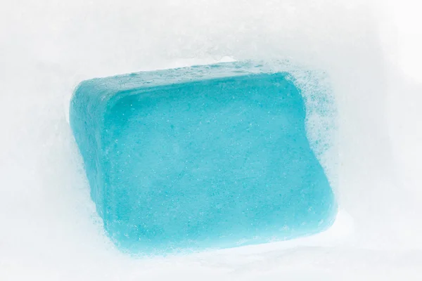 Blue soap with foam on white background — Stock Photo, Image