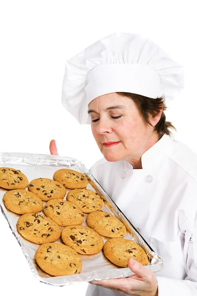 Chef-kok bakt cookies Stockfoto