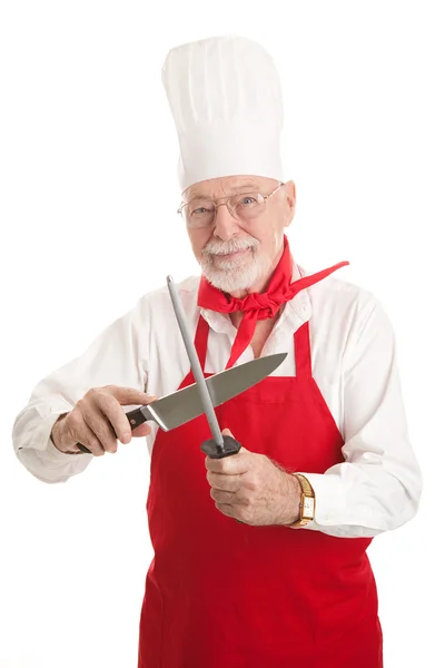 Mature Chef Sharpens Knife — Stock Photo, Image