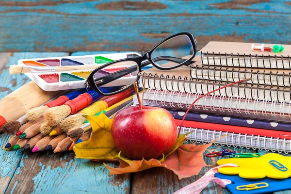 Office or school supplies on wooden planks — Stock Photo, Image