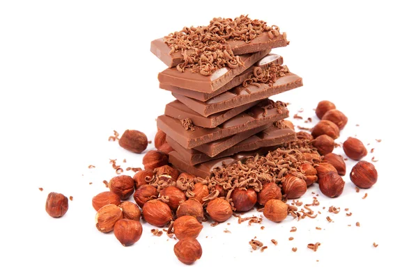 Chocolate and nuts on white background. — Stock Photo, Image