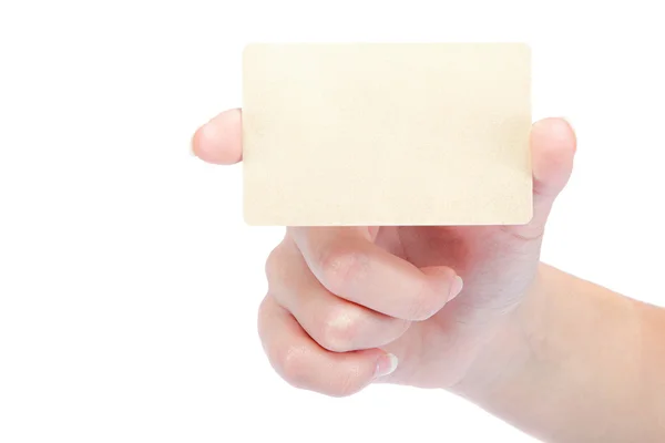 Beautiful female hand holding a gold blank card. — Stock Photo, Image