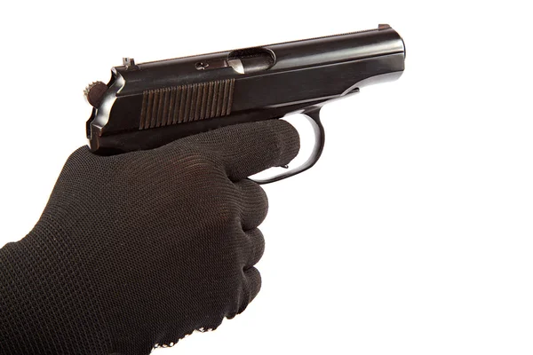 Pistole in der Hand mit schwarzen Handschuhen. — Stockfoto
