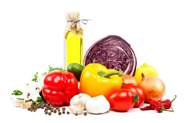 Fresh vegetables and olive oil on a white background. — Stock Photo, Image