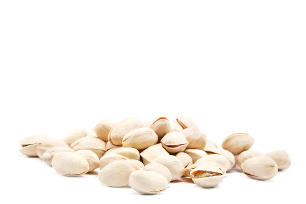 Pistachios heap against white background. — Stock Photo, Image