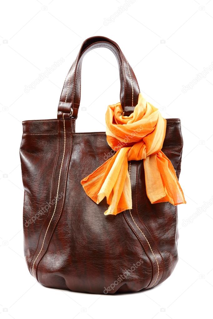 Modern fashionable female bag and scarf with tassels.