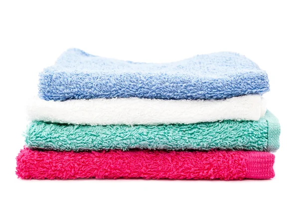 Stack of colored towels on white background. — Stock Photo, Image