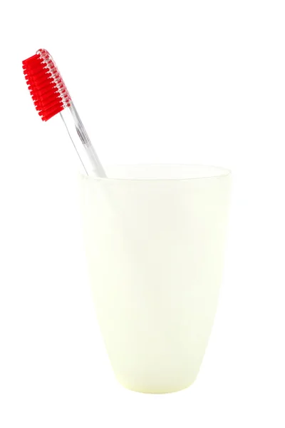 Toothbrush in a glass on a white background. — Stock Photo, Image