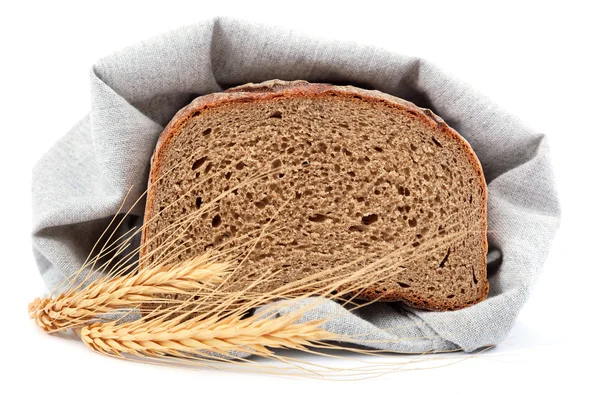 Loaf of bread and wheat ears. — Stock Photo, Image