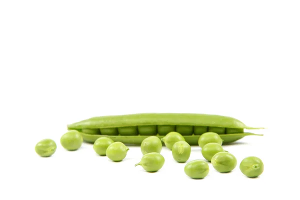 Green peas on a white background. — Stock Photo, Image