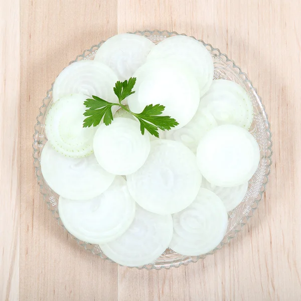 Fresh Onions cut into slices  on a wooden — Stock Photo, Image