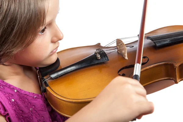 Kleines hübsches Mädchen spielt Geige auf weißem Hintergrund. — Stockfoto