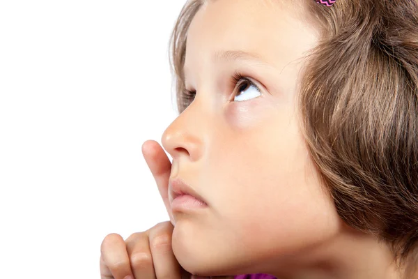 Little pretty girl with a pensive look. — Stock Photo, Image