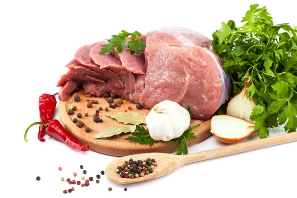 Meat on a cutting board on white background. — Stock Photo, Image