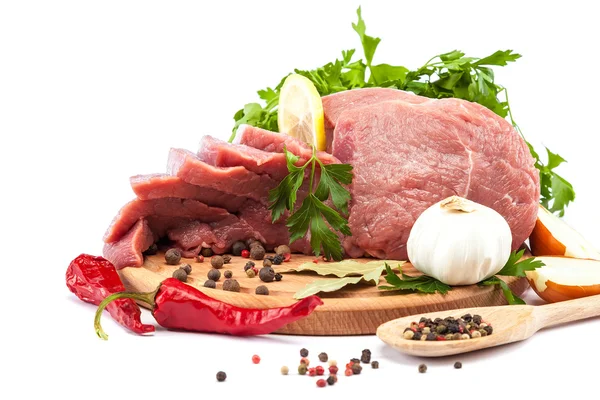 Meat on a cutting board on white background. — Stock Photo, Image