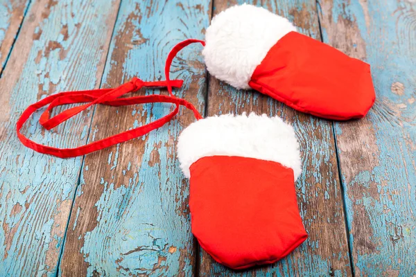 Christmas red mittens on wooden boards — Stock Photo, Image