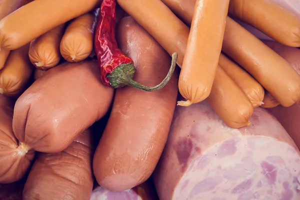 Sausages on a cutting wooden board — Stock Photo, Image