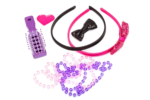 Hoops for the hair, barrettes, necklaces and hairbrush — Stock Photo, Image