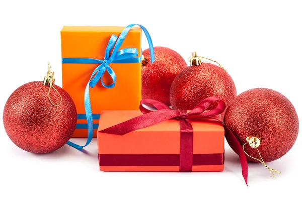 Christmas balls and packaging with gifts — Stock Photo, Image