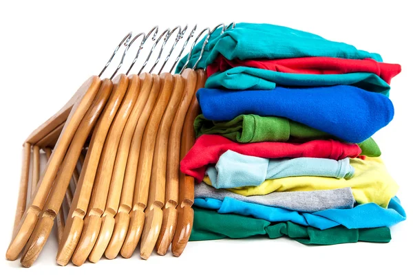 Hangers with clothes on a white background. — Stock Photo, Image