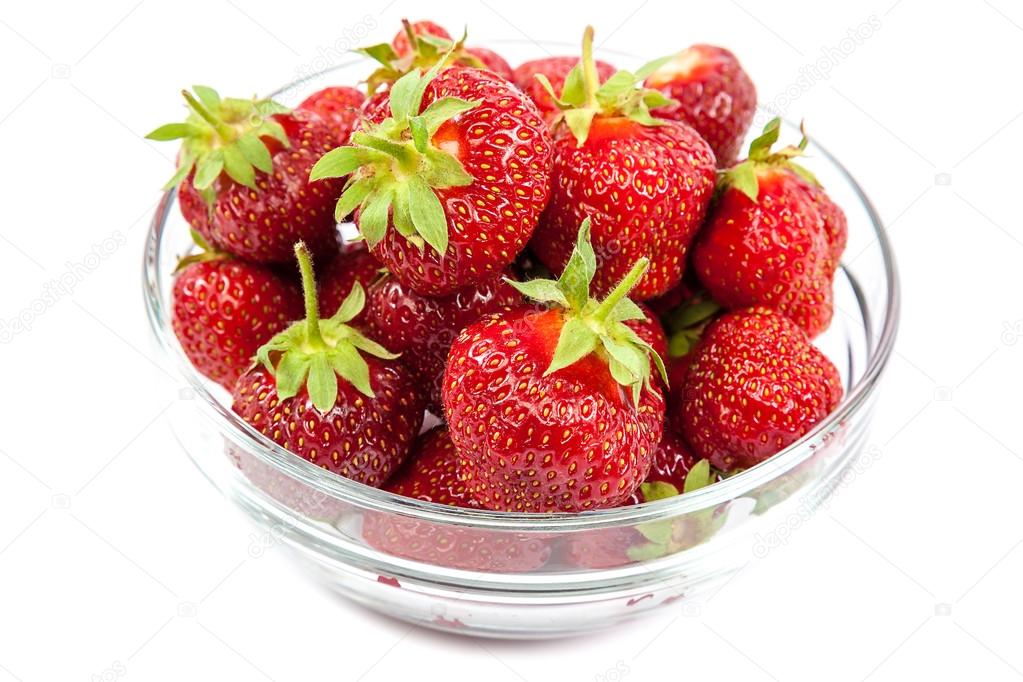 Fresh strawberries in a glass bowl.