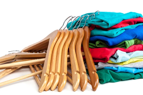 Hangers with clothes on a white background. — Stock Photo, Image