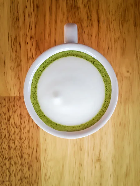 Green tea latte on wood table — Stock Photo, Image