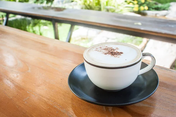 Capucino coffee on wood table — Stock Photo, Image