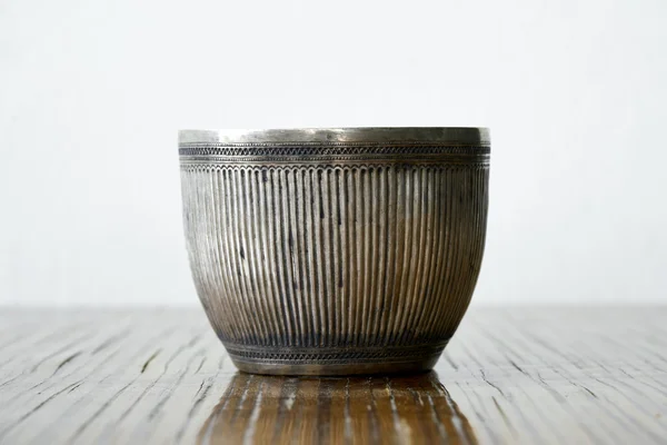 Antique silver bowl on wood table — Stock Photo, Image