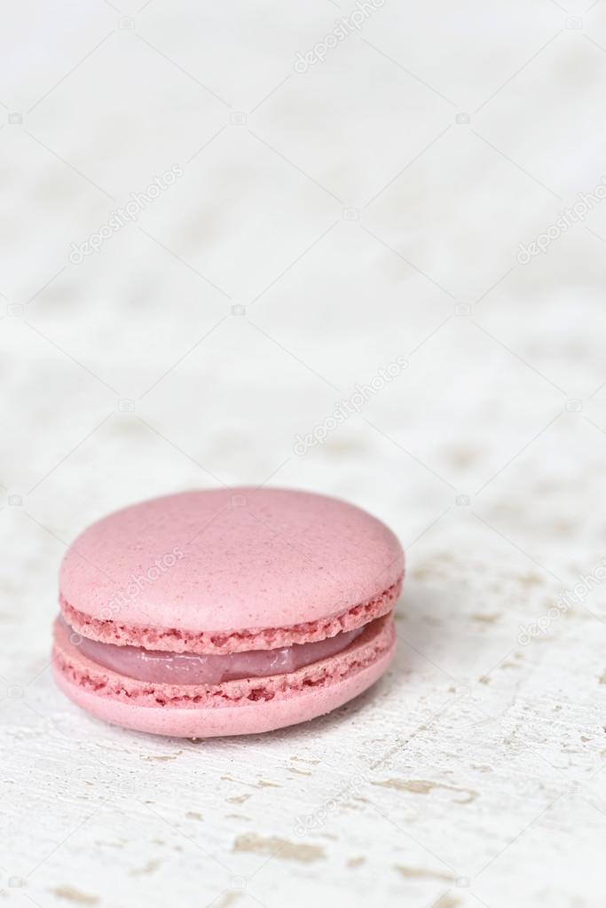 Pink macron on wood plate