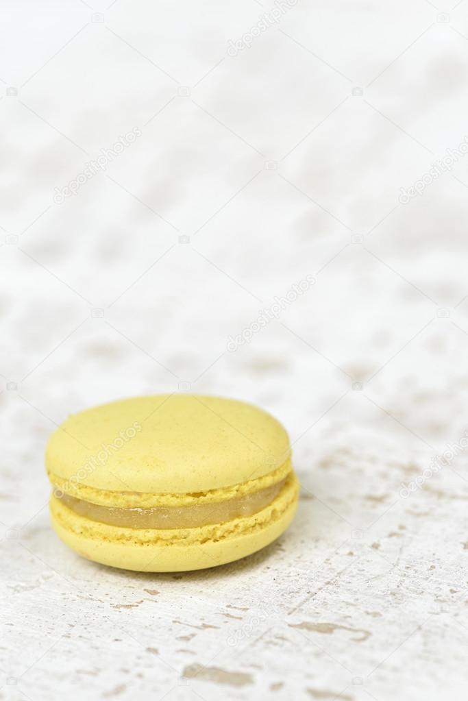 Yellow macron on wood plate