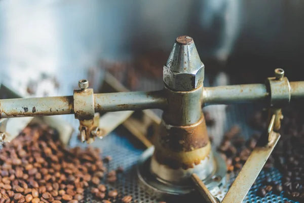 coffee bean roaster machine equipment working for beverage business job, roasting preparation process for coffee cafe, aromatic brown coffee roasted, aroma espresso hot drink.