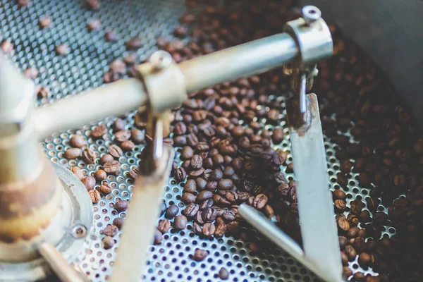 coffee bean roaster machine equipment working for beverage business job, roasting preparation process for coffee cafe, aromatic brown coffee roasted, aroma espresso hot drink.