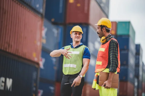 worker teamwork and partner of foreman, engineer, and businessman working in an international shipping area, concept of business industrial and working in container yard