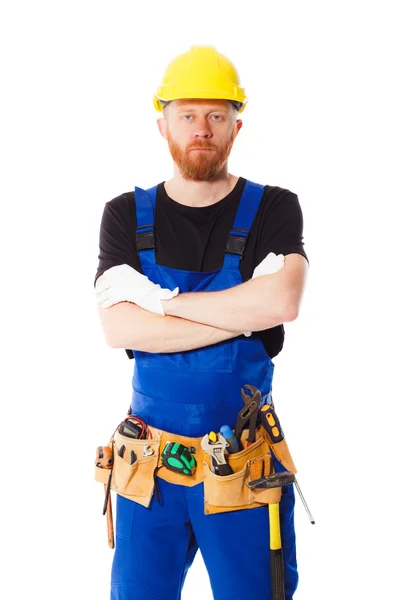 Young man builder with belt of construction tools — Stock Photo, Image