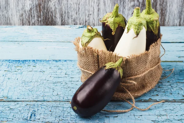 Colored eggplants in the pouch from burlap