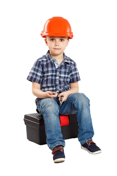 Menino no capacete de construção — Fotografia de Stock