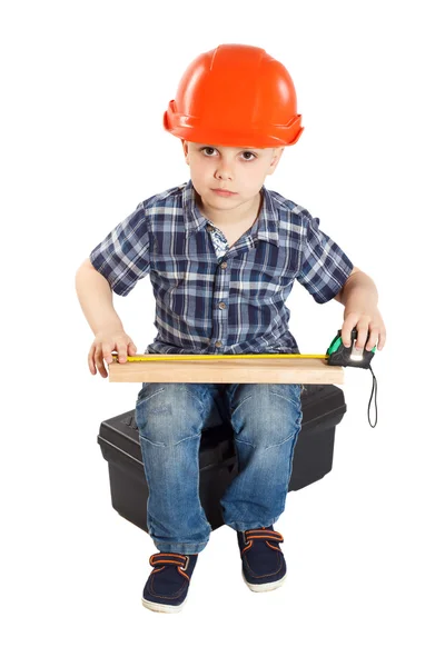 Menino no capacete de construção — Fotografia de Stock