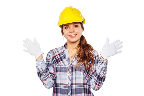 Jeune femme en casque de construction jaune — Photo