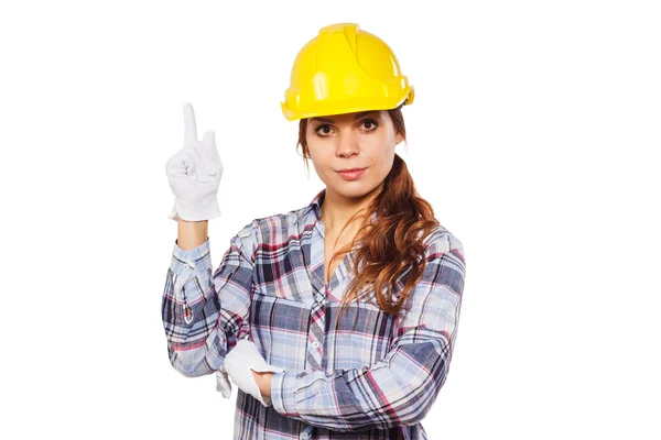 Jeune femme en casque de construction jaune — Photo