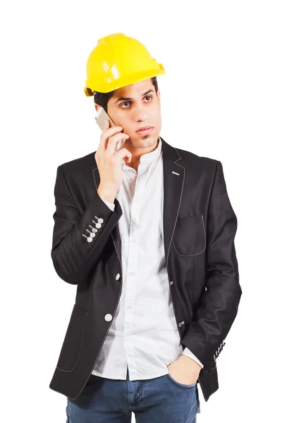 Mladý dělník mluví na telefonu — Stock fotografie