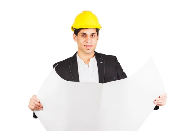 Jeune homme dans un casque de construction avec un dessin architectural — Photo