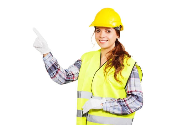 Jeune femme en casque de construction et gilet jaune — Photo