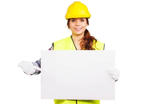 Jeune femme dans la construction casque avec plaque signalétique — Photo