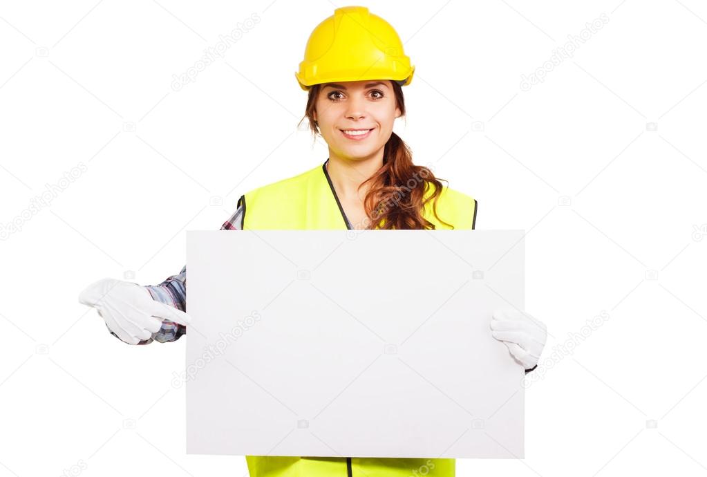 Young woman in construction helmet with nameplate