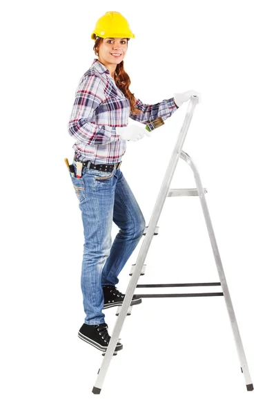 Young smiling worker stands on the building stairs — Stock Photo, Image